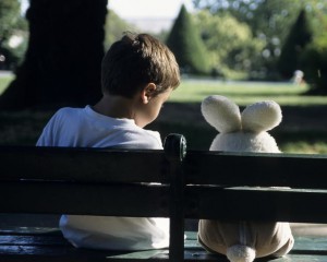 boy-sitting-on-park-bench-with-teddy-bear-sami-sarkis
